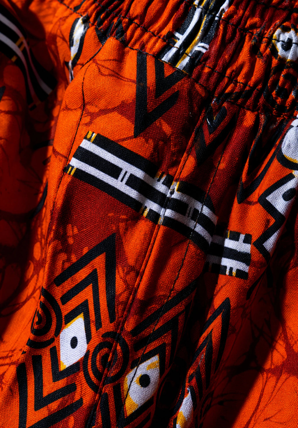 Unisex Kitenge Trousers – Orange Geometric Print